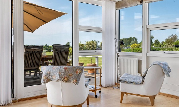 Roskilde House | Highly furnished wooden house with wood-burning stove, fjord view and boat dock.