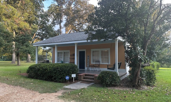 Natchez Cottage | Historic cottage privately situated on the grounds of the Foster Mounds.