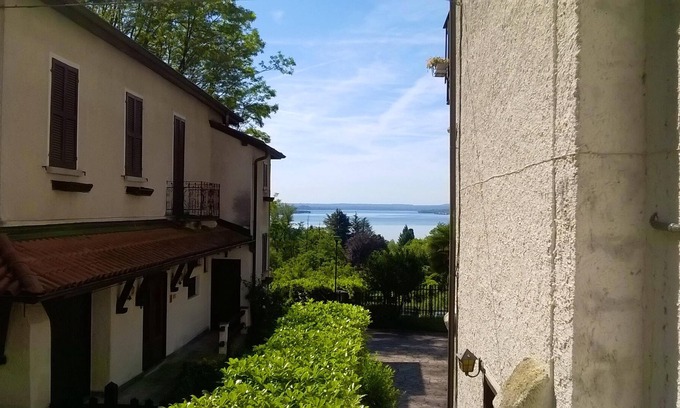 Nebbiuno Apartment | Homerez - Appartement 1 km away from the beach for 4 ppl. with balcony at Lesa