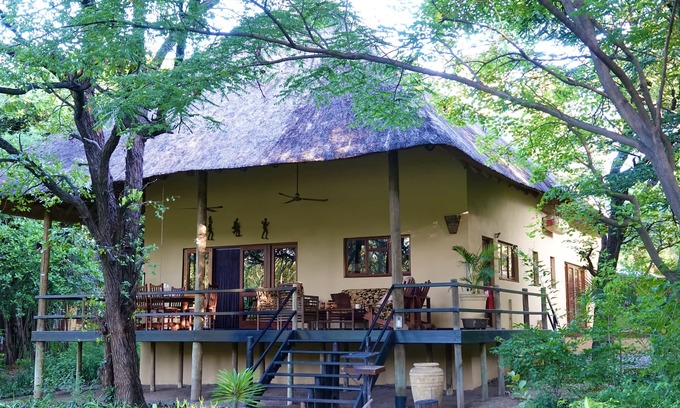 Phalaborwa Villa | Luxury Villa 1 km from Kruger Park veranda overlooking the garden and ponds