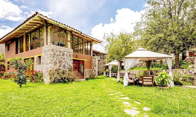 Huaran House | Modern and comfortable house with stunning views of the mountains and waterfall.