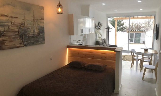 Ponta Delgada House | Oceanfront studio with private cobblestone patio and direct access to ocean pool