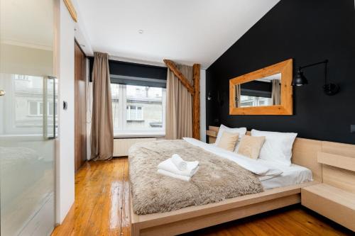 Wesoła Zachod Apartment | Old Town Wooden Loft Apartment by BookingHost