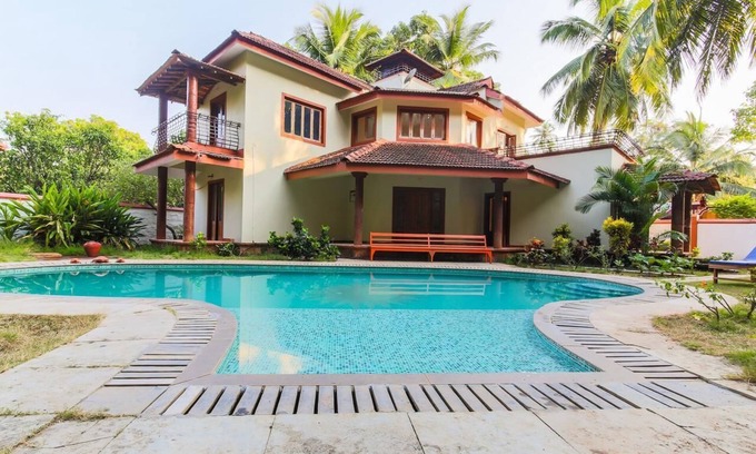 Morjim House | Outdoor Pool with Classic Bedroom in Goa