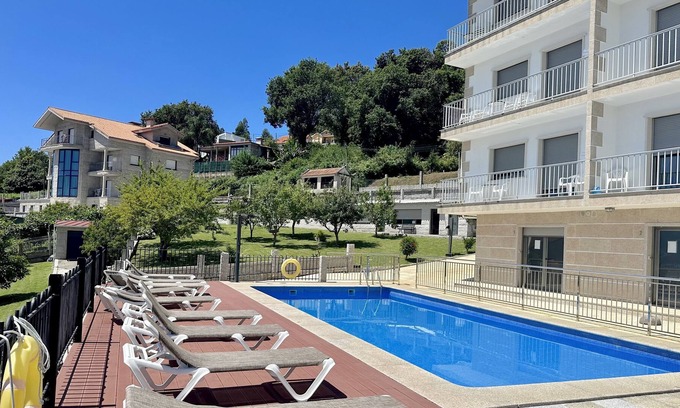 Raxo Apartment | Pool, garden, playground, tennis court and barbecue. 400 m. the beach