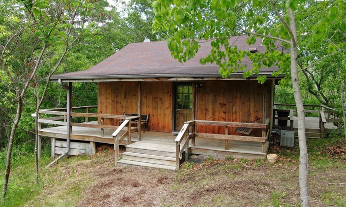Norwalk Cabin | Quaint cabin overlooking the creek below and wetlands in the valley basin.