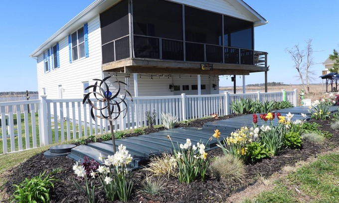 Prime Hook Beach House | Quiet dog friendly home overlooking nature preserve, 1 block from private beach.