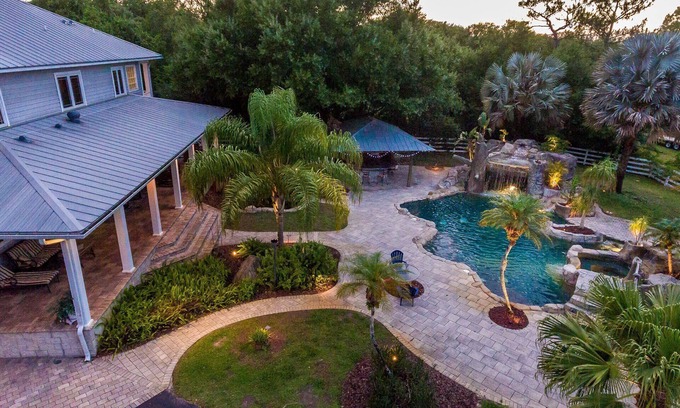 Greater Northdale House | Resort style pool with lazy river, grotto, & hot tub! Dog-Friendly! Golf Haven!
