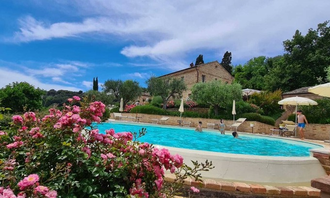Potenza Picena Villa | Resort surrounded by greenery arranged for families or groups with an infinity pool.