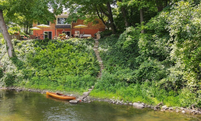 Dexter House | Riverside retreat with hot tub on the Huron River! 10 miles to UofM!