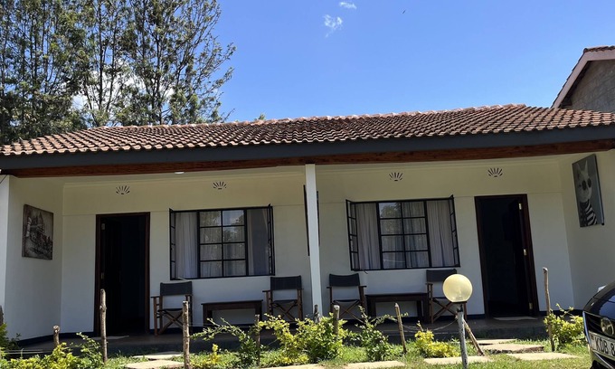 Nanyuki Apartment | Rustic, farm house space surrounded by trees and near a river.