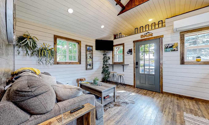 Evergreen House | Rustic getaway with fireplace, patio area, board games, full kitchen, & TV