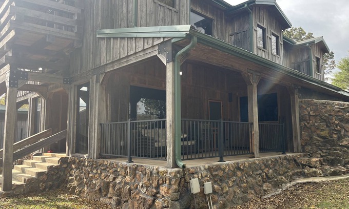 Wyandotte Cabin | Rustic Lodge with a view of open pastures and bison grazing on the land.