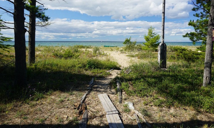 Cheboygan Cabin | Secluded Beach Front Log Cabin Next to Nature Preserve