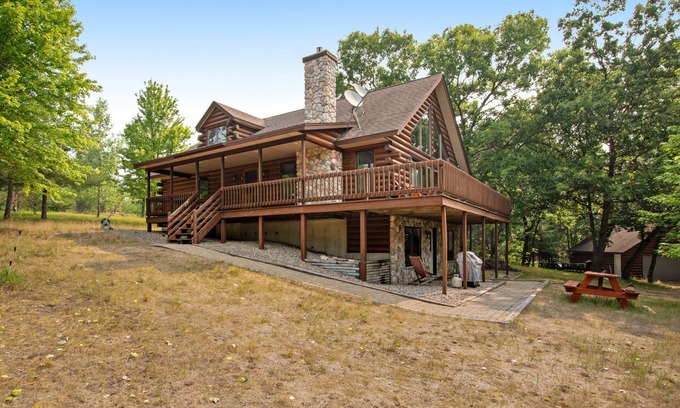 Friendship Cabin | Secluded, dog-friendly home with tree-lined view, firepit, fireplace, & deck