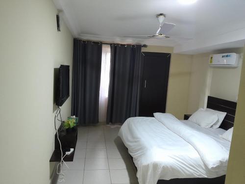 Madina Apartment | Serene Royal Residence