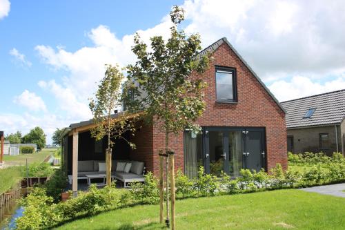 Sint Maarten House | Slapen tussen de duinen by Droomvilla