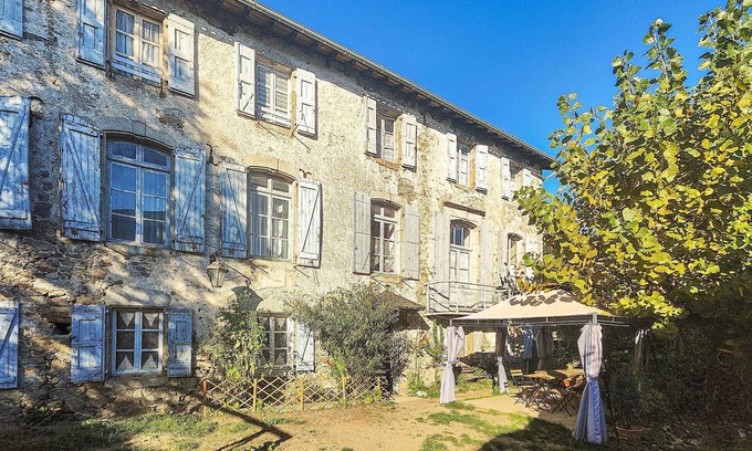 Angles House | Spend a relaxing vacation in this inviting cottage with rustic charm.