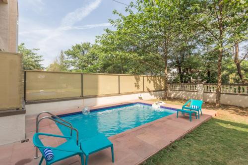 St.Stanislaus Villa Villa | StayVista's Greenwoods Villa 5 - City-Center Villa with Private Pool, Terrace, Lift & Music System