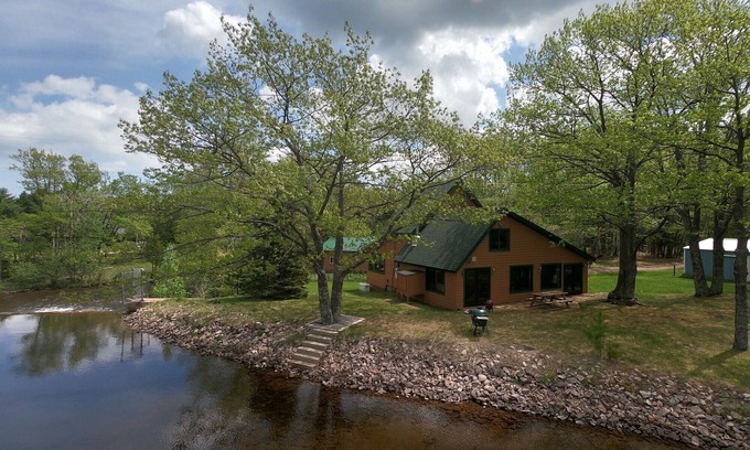 Big Bay House | "The Dam House" Lake and River Front Home with Beautiful Sunset Views