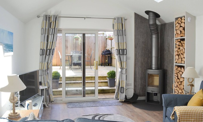 Treator Cottage | This ground floor apartment benefits from it’s own private decked area.