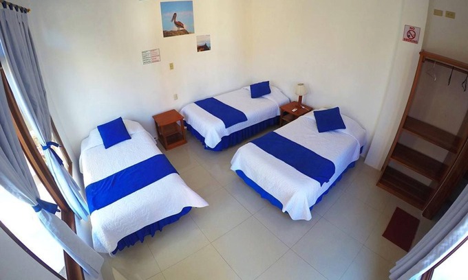 Puerto Villamil House | Tour to volcan, swim with sharks! Tripple Room Suite #1