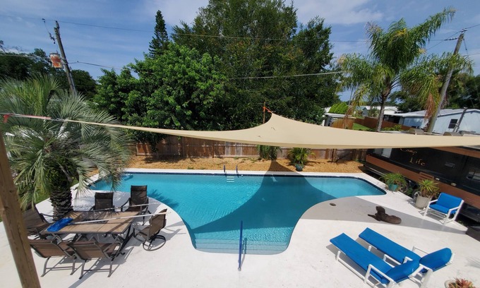 Cocoa House | Tropical backyard with pool, sandbox, toys, hammock. Pets+kids welcome