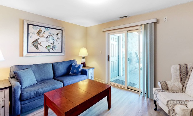 Heron Harbour Isle Condo | Updated Bayfront Condo w/ Canal Views, Balconies, Shared Pools - Walk to Beach