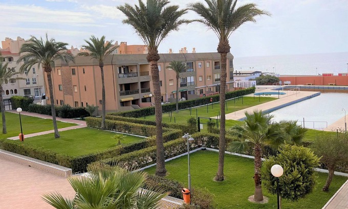 Retamar Apartment | Vibrant apartment in Retamar with garden