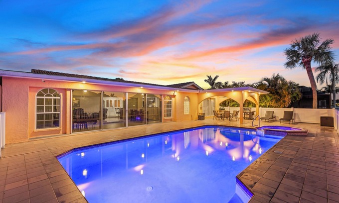 Gulf Harbors House | Water Front Home with Heated Pool & Hot Tub, 2 Master Suites & a Floating Dock