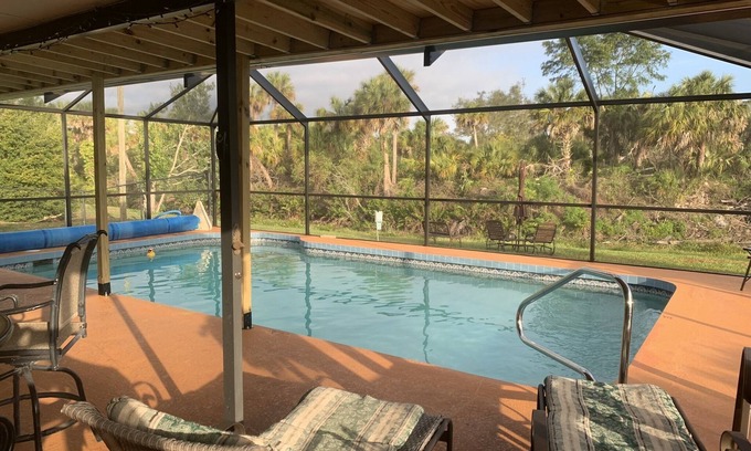 Venice Groves House | Waterfront single home rental with private lanai, heated pool, and hot tub!