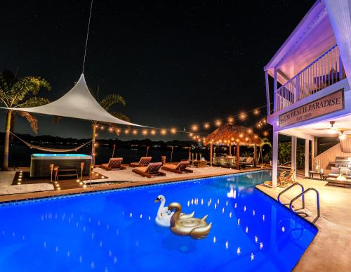 Florida North Atlantic Coast Villa | Waterfront Villa with Beach, Pool, Cinema, Game Room and Tiki