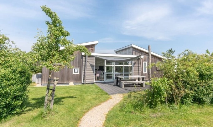 Westenschouwen House | You are guaranteed to unwind and relax in one of the chairs or on the comfy sofa in the central livi