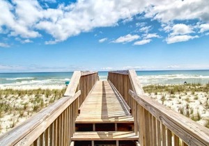 Coastal Condo in Navarre | Floor to Ceiling Windows and Free Beach Service!