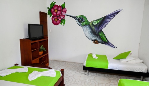 Room with 1 double bed and 3 single beds