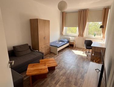 Four-Bedroom Apartment with Balcony 