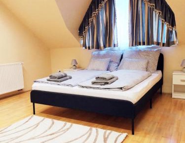 One-Bedroom Apartment with Balcony and City View
