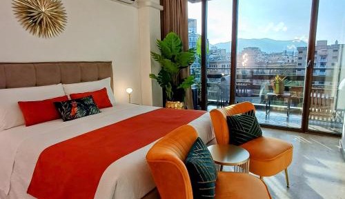 One-Bedroom Apartment with Balcony and City View
