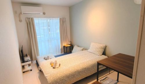 One-Bedroom Apartment with Balcony and City View