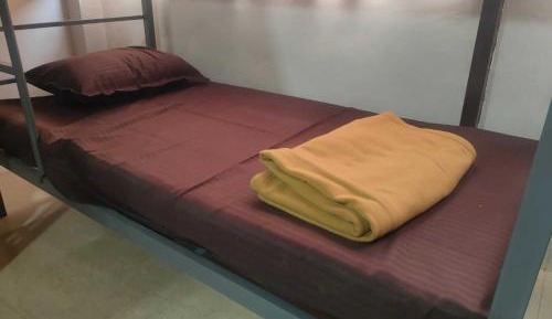 Single Bed in Dormitory Room