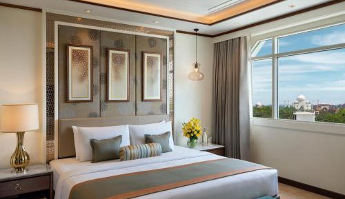 SeleQtions Suite Taj Mahal King Bed with one way airport transfer, complimentary mini-bar once, 10% discount on food, beverages, spa and laundry | Happy hour on buy one get one from 4pm to 6pm at Sky Deck