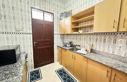 Dar es Salaam House | Unmatched Convenience: The Brownstone Provides Easy Access to Evrything You Need