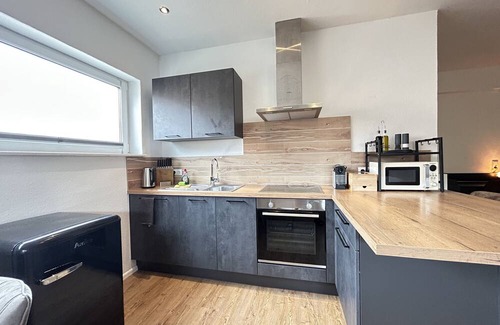 Mahlberg Apartment | Lumiflats: Deluxe Studioapartment mit Terrasse und Garten Nähe Europapark