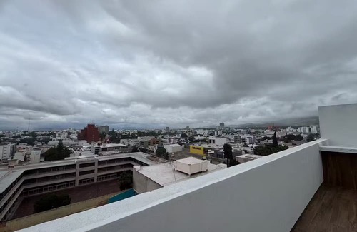 San Luis Potosi Apartment | Carranza Views! Heated Pool, KingBed & WorkSpace