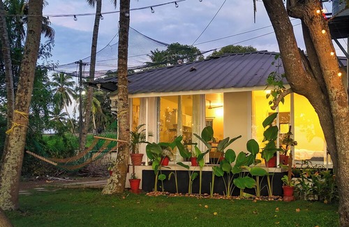 Munroe Island Cottage | Tropical Haven - 1BR Lakefront AC Cottage with Stunning Lakeview & Lake Access