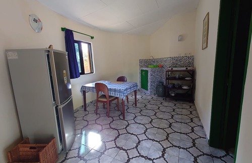 Comoe House | Round bungalow kitchenette on Lionsrest - on the West African Atlantic coast