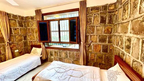 Wadi Bani Kharus Hotel | بيوت الضيافه