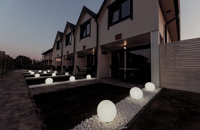 Comfortable and modern apartments located among meadows near a beautiful beach.