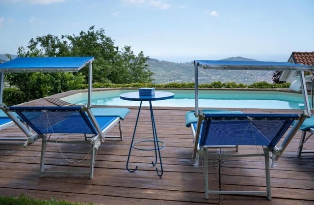 Detached vacation villa with sunny garden, panoramic pool and sea view