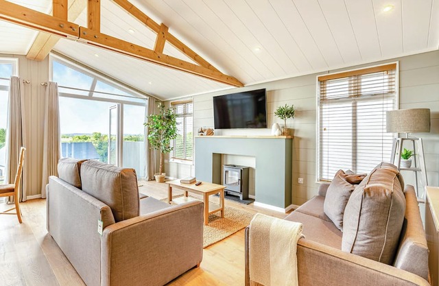 Luxurious lodge with vaulted ceilings and a welcoming feature fireplace.